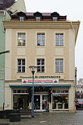 Residential building with a shop area in a closed area, on the corner of the Buttermarkt