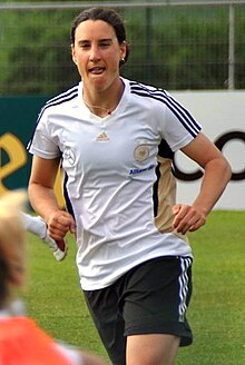 Birgit Prinz is the most capped German player with 214 caps, and the top ever scorer with 128. Birgit Prinz.jpg