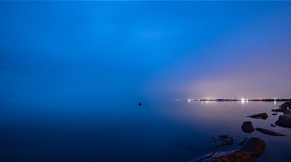 Evening view of Buffalo from Bayview Road in Hamburg. Steel Winds Urban Wind Farm can be seen in the distance.