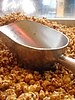 Large aluminum scoop, here with caramel corn