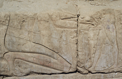 Ancient Egyptian carved scene of circumcision, from the inner northern wall of the Temple of Khonspekhrod at the Precinct of Mut, Luxor, Egypt. Eighteenth dynasty, Amenhotep III, c. 1360 BCE. Circumcision Precinct of Mut.png