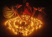 Homes, buildings and temples are decorated with festive lights, diya, for Diwali, the festival of lights.[76]