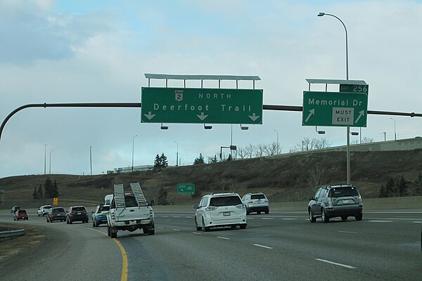 Northbound Deerfoot Trail curving at Memorial Drive and the Northeast Line of the CTrain. The interchange was constructed as part of the second Deerfo