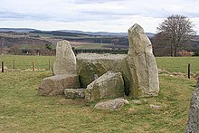 Easter Aquorthies stone circle showing the recumbent stone and two flankers East Aquhorthies Recumbent Stone Circle (5) (geograph 4407419).jpg