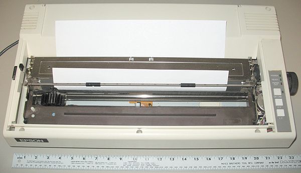 This is an example of a wide-carriage dot matrix printer, designed for 14-inch (360 mm) wide paper, shown with 8.5-by-14-inch (220 mm × 360 mm) legal 