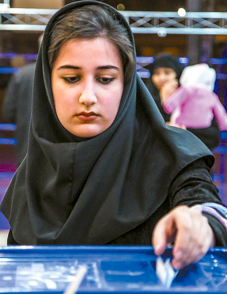 File:February 26 2016-Iranian legislative election-a voter casts her ballot in a box at a polling station in Nishapur.png