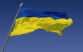 The national flag of Ukraine. The finial on the top of the flagpole is the coat of arms of Ukraine.
