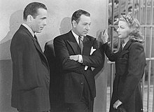 Left to right: Bogart, Raft, and Sheridan. Humphrey Bogart, George Raft, Ann Sheridan They Drive by Night Still.jpg