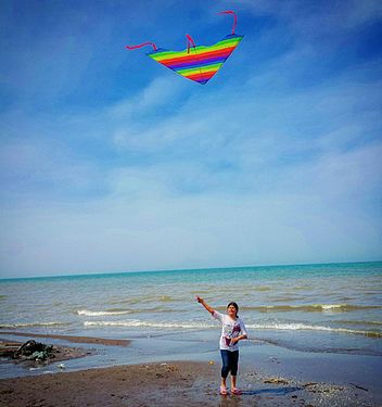 Iranian child playing kite