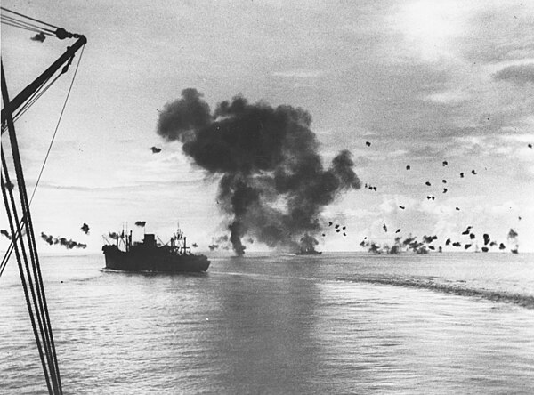 San Francisco (center) after being hit by a Japanese plane in the Naval Battle of Guadalcanal, 12 November 1942. Ship at left is President Jackson.