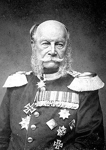 Photograph of an elderly Wilhelm, a bald man with side whiskers