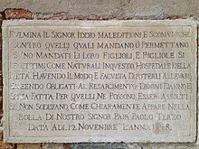 Plaque on the exterior of the church threatening excommunication to all who abandon children for whom they can provide. Lapide chiesa Pieta.JPG