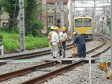 Maintenance of way workers repairing track in Japan Maintenance of Seibu Ikebukuro line.jpg