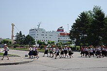 School children pass Man Gyong Bong 92 in North Korea. Mangyongbong-92 20080613.jpg