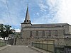 Kerk Notre-Dame de toren, de toegang en de grafstenen op de begane grond van het interieur