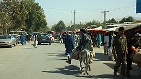 On the market street in Taloqan (8016345739).jpg