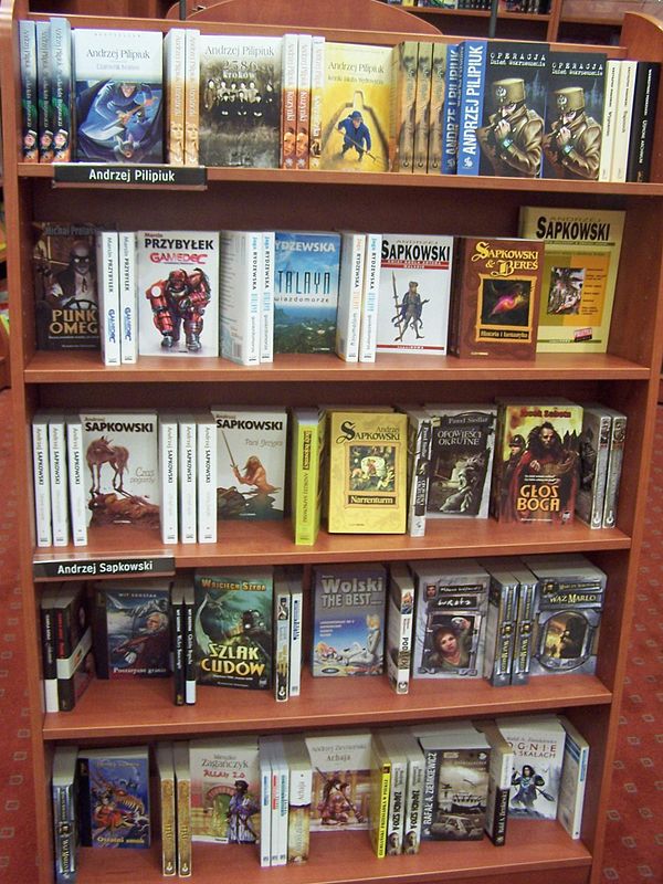 Sapkowski novels on display occupying two shelves at an Empik bookstore in Katowice, Poland