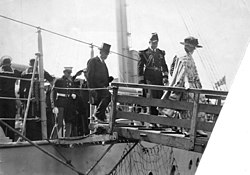 July 26, 1923: Ill from food poisoning, Warren G. Harding (in top hat) becomes first U.S. President to visit Canada President Harding visits Vancouver July 1923.jpg