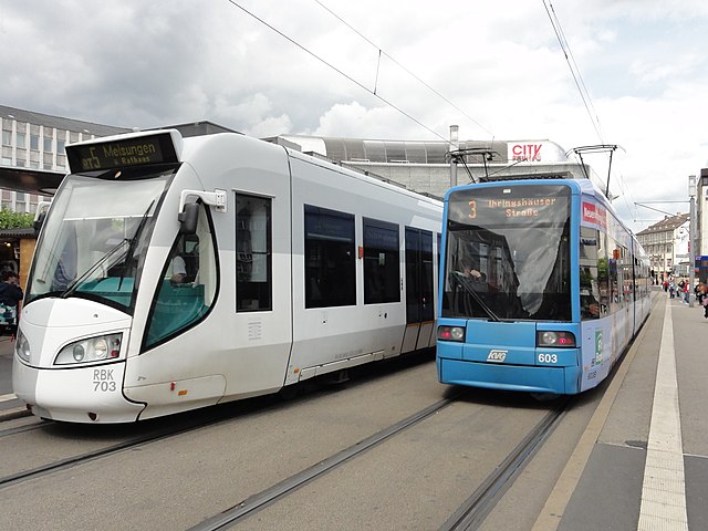 Kassel RegioTram dual voltage DC/AC Alstom RegioCitadis next to a KVG Bombardier Flexity Classic tram at Königsplatz