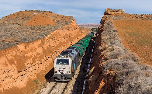 RENFE's 333.388 with a loaded coal train has just left the station of Samper, Spain