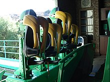 Trains feature saddle seats that move vertically to accommodate various heights. (The Riddler's Revenge at Six Flags Magic Mountain) Riddler's Revenge train.JPG