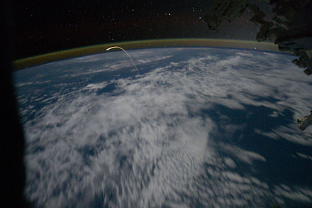 Plasma trail as Atlantis enters the atmosphere, as seen from the Space Station.