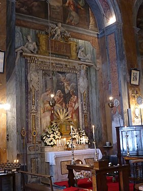 Tredje sidoaltaret på vänster hand med fresken Madonnan och Barnet med de heliga Katarina av Alexandria och Apollonia.