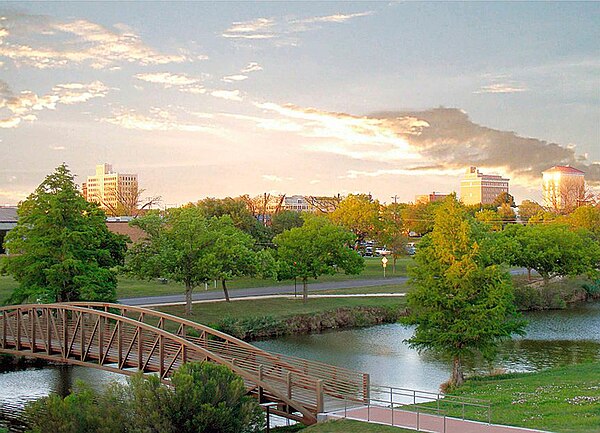 Pedestrian bridge at a park running along the Concho River