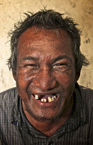 smiling homeless man