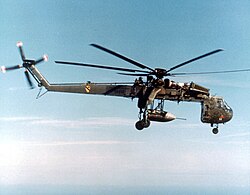 Sikorsky Skycrane carrying parachute bomb c.jpg