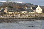 The Storehouse at Foulis Ferry with a snow-capped Fyrish Hill - geograph.org.uk - 667978.jpg