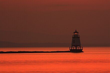 The lighthouse in Lake Champlain at dusk, as seen from Burlington, VT