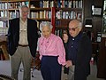 Tom Skinner standing beside Milton and Rose Friedman.