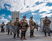 Georgia Air National Guard 116th and 165th Security Forces Squadron members in riot gear, June 2020. U.S. Airmen and Soldiers from the Georgia National Guard assist law enforcement agencies during Atlanta protests.jpg