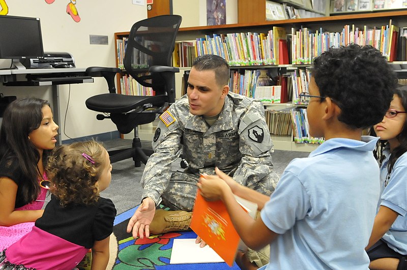 File:U.S. Army 2nd Lt. Monserrate Vergara, center, with the 1st Mission Support Command, Puerto Rico Army Reserve, reads a Thanksgiving book to several local children, while participating in a story time event in 131120-A-CC868-351.jpg