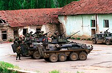 Members of the 2nd Light Armored Reconnaissance Battalion prepare to conduct a patrol in Kosovo during June 1999 USMC LAV-25s in Zegra, Kosovo (June 27, 1999).jpg