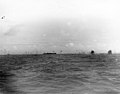 Ships' anti-aircraft fire and explosions from downed enemy planes are visible from aboard USS Princeton, 14 October 1944.