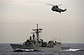 US Navy 031017-N-1056B-003 The guided missile frigate USS Nicholas (FFG 47) and a helicopter from the Spanish frigate SPS Navarra (F-85) track a simulated cargo vessel.jpg