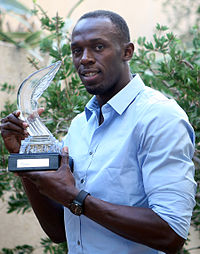 Hekkeløperen Sally Pearson med sin første pris og sprinteren Usain Bolt med sin tredje av i alt seks priser, under IAAF Awards 2011.