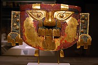 Sican headdress mask; 10th-11th century; gold, silver & paint; height: 29.2 cm (111⁄2 in.); Metropolitan Museum of Art. This mask comprises the lower part of a ceremonial Sican headdress. The entire headdress comprised the mask and a tall circular crown embellished with sacred motifs and vertical ornaments, all of gold, encircled by iridescent tropical bird feathers and golden replicas