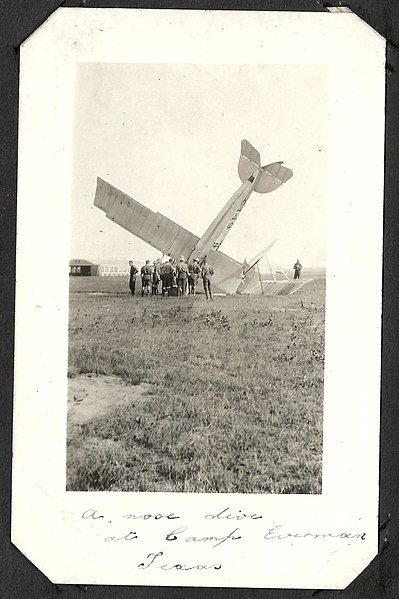File:"A nose dive at Camp Everman Texas"- photograph of a crashed aircraft (number C149) surrounded by a group of men in uniform. (7980840994).jpg