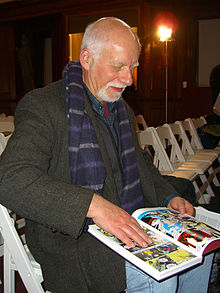 Writer Chris Claremont looks through a copy of a hardcover X-Men volume that collects many of the issues he wrote, March 2012. 3.24.12ChrisClaremontByLuigiNovi4.jpg