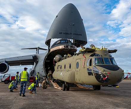 Unloading one of two Chinook helicopters from a C-5M Super Galaxy