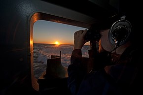 A sailor keeps watch aboard USS George H.W. Bush. A Sailor stands watch aboard USS George H.W. Bush..jpg