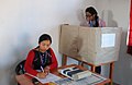A young voter casting her vote at a polling booth during the Meghalaya Assembly Election, in North Shillong on February 23, 2013.jpg