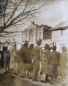 Troops rioting on the roof of the 'Glasshouse' in February 1946 Aldershot Glasshouse riot 1946.jpg