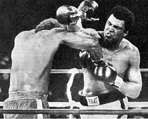 October 30, 1974: Muhammad Ali defeats George Foreman in "The Rumble in the Jungle" in Kinshasa, Zaire. Ali hitting foreman.jpg