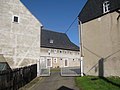 Residential stable house and side building of a four-sided courtyard