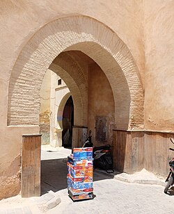 The original Bab Bou Jeloud, a more modest structure with a bent entrance, still extant next to the monumental gate of 1913 Bab Bou Jeloud old gate DSCF3337.jpg