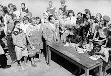 August 1947, German women and girls released from Soviet captivity wait in 14 days of quarantine at the Polte Nord returnee camp, before finally going home. Bundesarchiv Bild 183-1983-0422-308, Heimkehrerlager Polte Nord.jpg